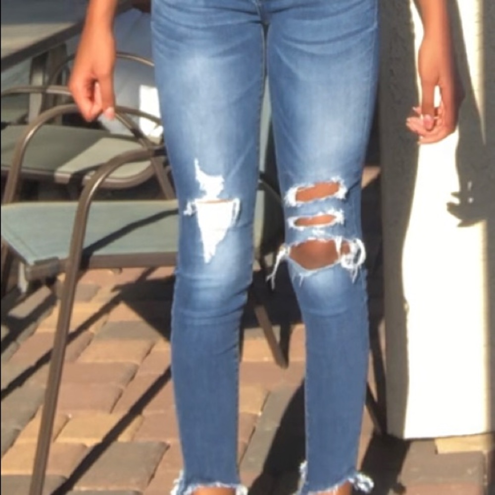 Low-waisted ripped jeans